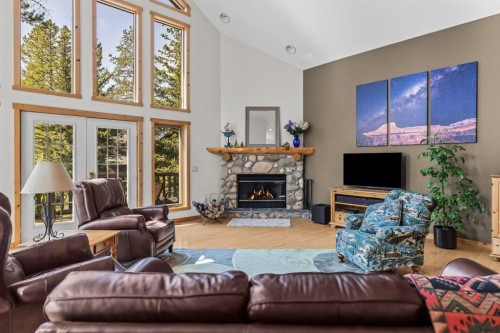 18 Juniper Ridge, Canmore, AB - Indoor Photo Showing Living Room With Fireplace