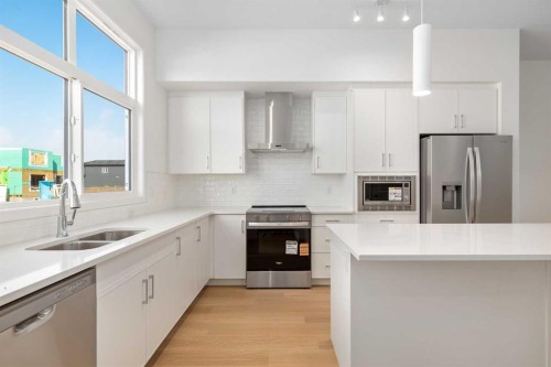 449 Hotchkiss Drive Se, Calgary, AB - Indoor Photo Showing Kitchen With Stainless Steel Kitchen With Double Sink With Upgraded Kitchen