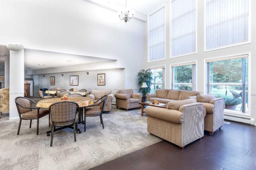 136-5000 Somervale Court Sw, Calgary, AB - Indoor Photo Showing Living Room