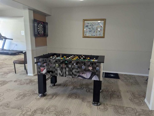 136-5000 Somervale Court Sw, Calgary, AB - Indoor Photo Showing Other Room