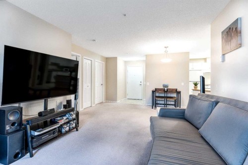 136-5000 Somervale Court Sw, Calgary, AB - Indoor Photo Showing Living Room
