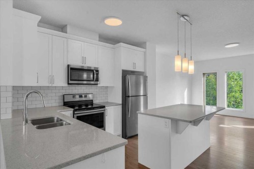 417 Legacy Boulevard Se, Calgary, AB - Indoor Photo Showing Kitchen With Stainless Steel Kitchen With Double Sink With Upgraded Kitchen