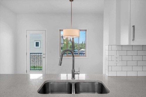 417 Legacy Boulevard Se, Calgary, AB - Indoor Photo Showing Kitchen With Double Sink
