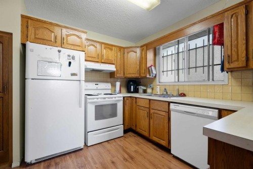 1521 44 Street Se, Calgary, AB - Indoor Photo Showing Kitchen With Double Sink