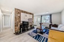 948 Rundlecairn Way Ne, Calgary, AB  - Indoor Photo Showing Living Room 