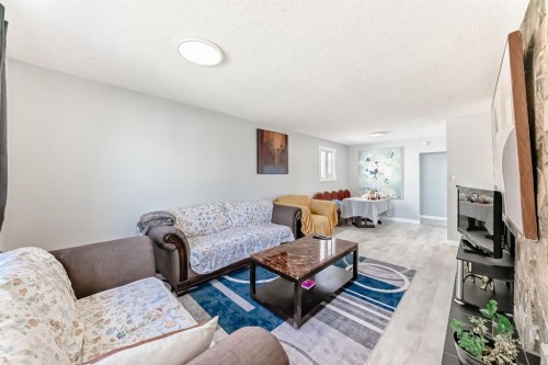948 Rundlecairn Way Ne, Calgary, AB - Indoor Photo Showing Living Room