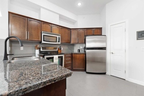 407-488 7 Avenue Ne, Calgary, AB - Indoor Photo Showing Kitchen With Stainless Steel Kitchen With Double Sink