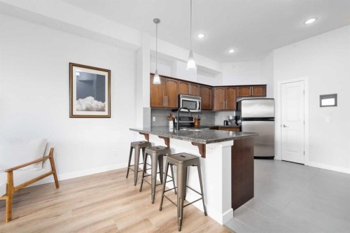 407-488 7 Avenue Ne, Calgary, AB - Indoor Photo Showing Kitchen With Stainless Steel Kitchen
