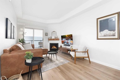 407-488 7 Avenue Ne, Calgary, AB - Indoor Photo Showing Living Room With Fireplace