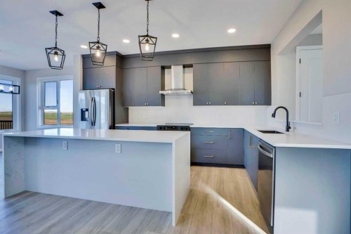 305 Lucas Place Nw, Calgary, AB - Indoor Photo Showing Kitchen With Stainless Steel Kitchen With Upgraded Kitchen