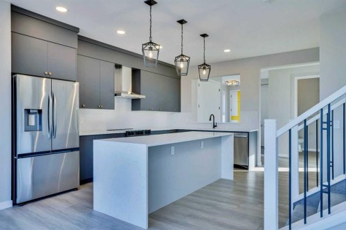 305 Lucas Place Nw, Calgary, AB - Indoor Photo Showing Kitchen With Stainless Steel Kitchen With Upgraded Kitchen