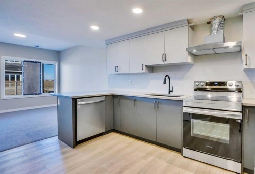 305 Lucas Place Nw, Calgary, AB - Indoor Photo Showing Kitchen With Stainless Steel Kitchen