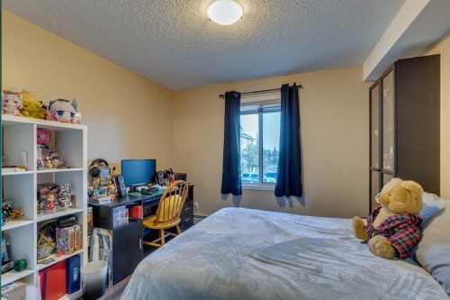 2205-2518 Fish Creek Boulevard Sw, Calgary, AB - Indoor Photo Showing Bedroom
