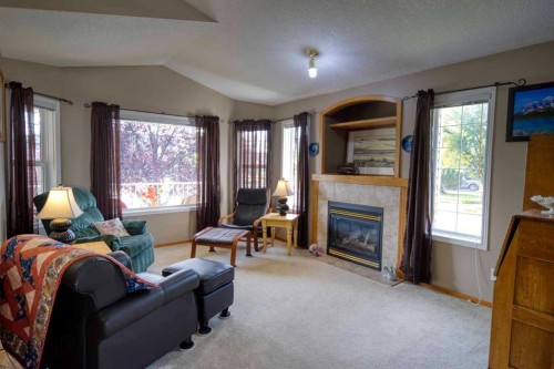 161 West Lakeview Drive, Chestermere, AB - Indoor Photo Showing Living Room With Fireplace