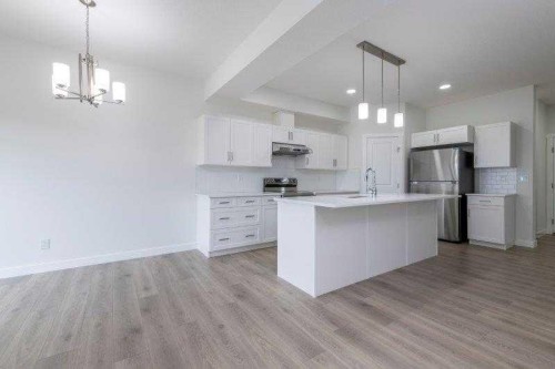 33 Walcrest Lane Se, Calgary, AB - Indoor Photo Showing Kitchen With Upgraded Kitchen