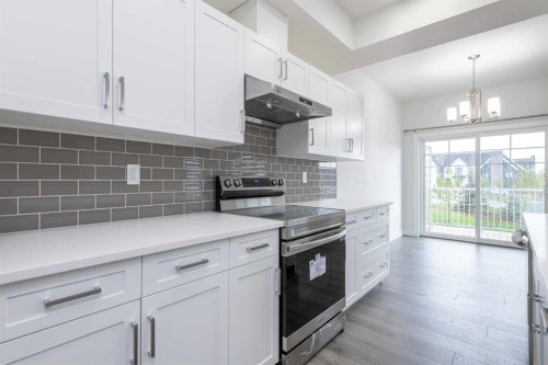 33 Walcrest Lane Se, Calgary, AB - Indoor Photo Showing Kitchen With Upgraded Kitchen
