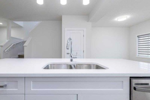 33 Walcrest Lane Se, Calgary, AB - Indoor Photo Showing Kitchen With Double Sink