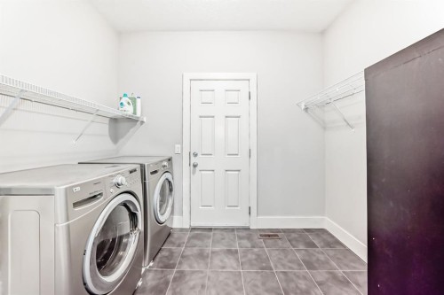 14 Heritage View, Cochrane, AB - Indoor Photo Showing Laundry Room