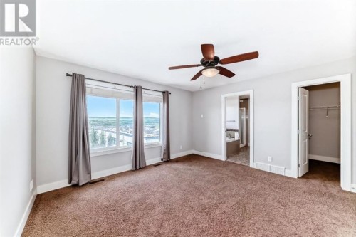 14 Heritage View, Cochrane, AB - Indoor Photo Showing Other Room