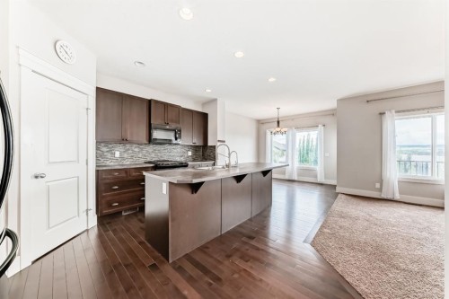 14 Heritage View, Cochrane, AB - Indoor Photo Showing Kitchen With Upgraded Kitchen