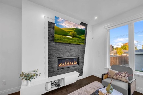 2640 28 Street Sw, Calgary, AB - Indoor Photo Showing Living Room With Fireplace