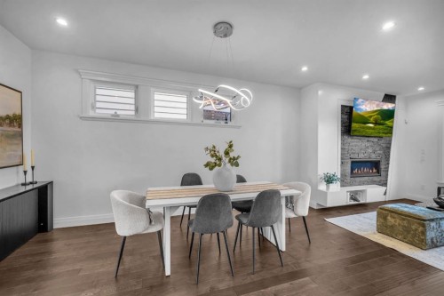 2640 28 Street Sw, Calgary, AB - Indoor Photo Showing Dining Room With Fireplace