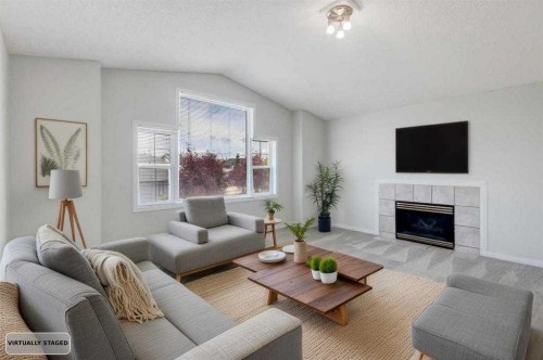 26 Rocky Ridge Heights Nw, Calgary, AB - Indoor Photo Showing Living Room With Fireplace