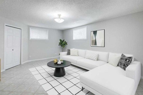26 Rocky Ridge Heights Nw, Calgary, AB - Indoor Photo Showing Living Room
