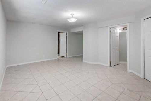 26 Rocky Ridge Heights Nw, Calgary, AB - Indoor Photo Showing Other Room