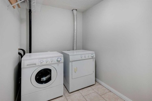 26 Rocky Ridge Heights Nw, Calgary, AB - Indoor Photo Showing Laundry Room