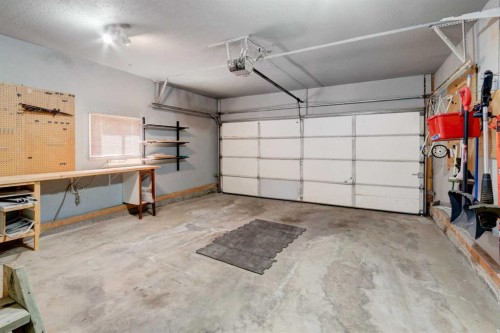 26 Rocky Ridge Heights Nw, Calgary, AB - Indoor Photo Showing Garage