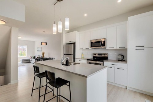 536 Canals Crossing Sw, Airdrie, AB - Indoor Photo Showing Kitchen With Stainless Steel Kitchen With Double Sink With Upgraded Kitchen