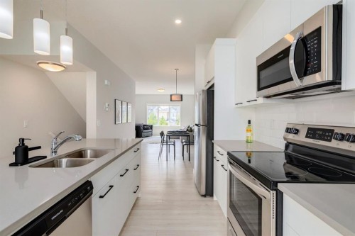 536 Canals Crossing Sw, Airdrie, AB - Indoor Photo Showing Kitchen With Stainless Steel Kitchen With Double Sink With Upgraded Kitchen