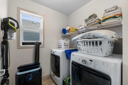 107 Masters Heights Se, Calgary, AB - Indoor Photo Showing Laundry Room