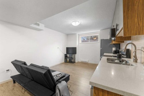 107 Masters Heights Se, Calgary, AB - Indoor Photo Showing Kitchen With Double Sink