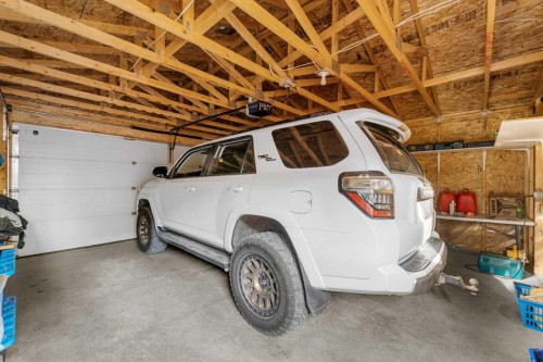 107 Masters Heights Se, Calgary, AB - Indoor Photo Showing Garage