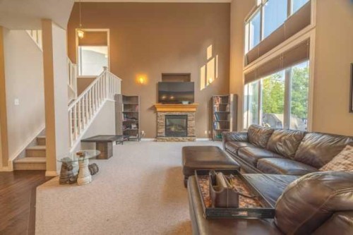 28 Crestmont Way Sw, Calgary, AB - Indoor Photo Showing Living Room With Fireplace