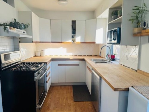 25 Rossdale Road Sw, Calgary, AB - Indoor Photo Showing Kitchen With Double Sink
