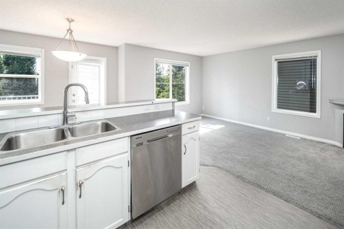 17 Hidden Creek Rise Nw, Calgary, AB - Indoor Photo Showing Kitchen With Double Sink