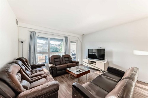 102-1629 38 Street Sw, Calgary, AB - Indoor Photo Showing Living Room