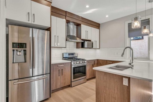 1-1936 26 Street Sw, Calgary, AB - Indoor Photo Showing Kitchen With Stainless Steel Kitchen With Double Sink With Upgraded Kitchen