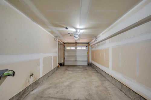 304 Windstone Gardens Sw, Airdrie, AB - Indoor Photo Showing Garage