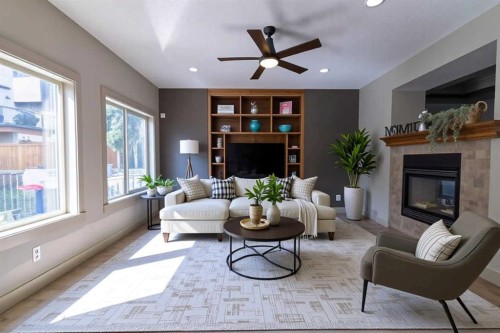 52 Elmont Green Sw, Calgary, AB - Indoor Photo Showing Living Room With Fireplace