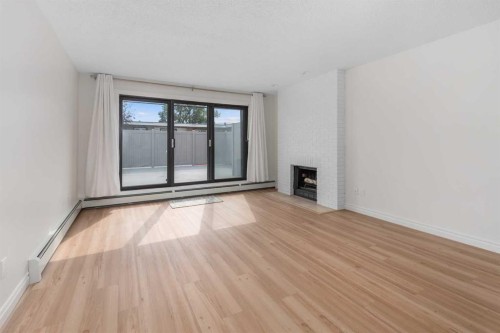 202-611 67 Avenue Sw, Calgary, AB - Indoor With Fireplace