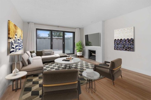 202-611 67 Avenue Sw, Calgary, AB - Indoor Photo Showing Living Room With Fireplace