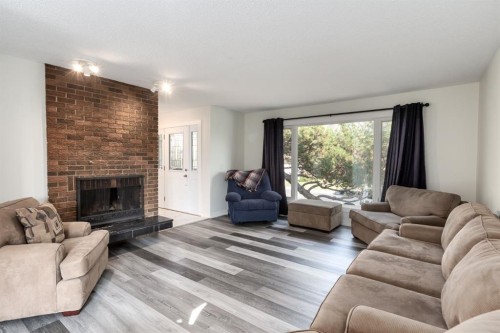 207 Whiteview Bay Ne, Calgary, AB - Indoor Photo Showing Living Room With Fireplace