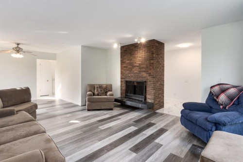 207 Whiteview Bay Ne, Calgary, AB - Indoor Photo Showing Living Room With Fireplace