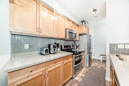 214-2 Hemlock Crescent Sw, Calgary, AB - Indoor Photo Showing Kitchen With Stainless Steel Kitchen With Double Sink