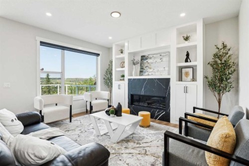 182 Panamount Road Nw, Calgary, AB - Indoor Photo Showing Living Room With Fireplace
