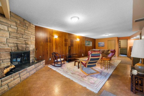 10 Varsville Place Nw, Calgary, AB - Indoor Photo Showing Living Room With Fireplace